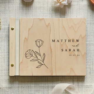 This is a beige guest books by Katrina Mejia called natural & elegant wedding guest book | maple wood | 8.5 x 11 in standard