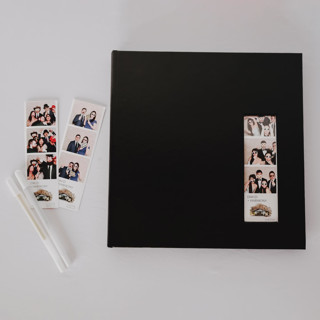 This is a black guest books by Ribbon and Rings called black photo booth guest book in standard