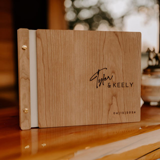 This is a beige guest books by Katrina Mejia called classic wedding guest book | cherry wood | 8.5 x 11 in standard