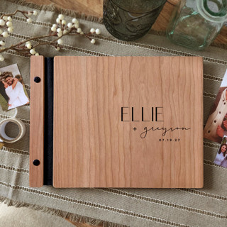 This is a black guest books by Katrina Mejia called mid-century modern wedding guest book | cherry wood | 8.5 x 11 in standard