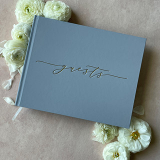 This is a blue guest books by Barbara Gregory called dusty blue minimalist guest book in standard