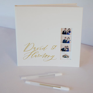 This is a white guest books by Ribbon and Rings called white photo booth guest book in standard