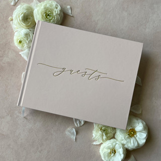 This is a pink guest books by Barbara Gregory called blush nude minimalist guest book in standard
