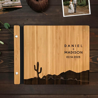 This is a black guest books by Katrina Mejia called western desert cactus wedding guest book | amber bamboo | 8.5 x 11 in standard