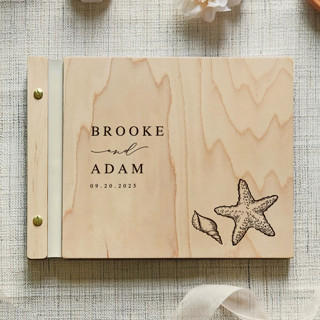 This is a beige guest books by Katrina Mejia called beachside wedding guest book | maple wood | 8.5 x 11 in standard