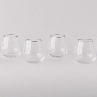 This is a clear wedding decor by Cassandra Stearns called SET OF 4 - SIREN STEMWARE // SHORT STEMLESS IN CLEAR+PLATINUM in standard.