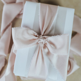 This is a pink wedding ribbon by Jordan Perry called wedding ribbon sateen 1.5" wide blush pink in standard