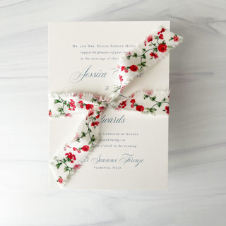 This is a red wedding ribbon by Honey Silks Co called 1" cotton ribbon - red floral in standard