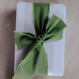 This is a green wedding ribbon by Jordan Perry called ribbon linen 1.5" wide green in standard