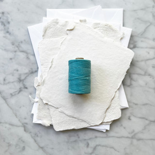This is a blue wedding ribbon by Jenny Sanders called caribbean blue waxed linen twine, 2-ply in standard