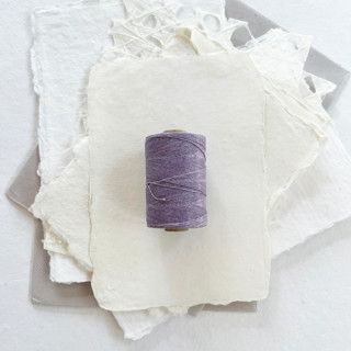 This is a purple wedding ribbon by Jenny Sanders called wisteria waxed linen twine, 2-ply in standard