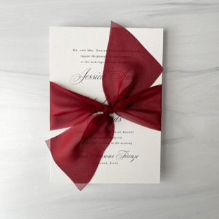 This is a red wedding ribbon by Honey Silks Co called 2" signature sheer ribbon - scarlet in standard
