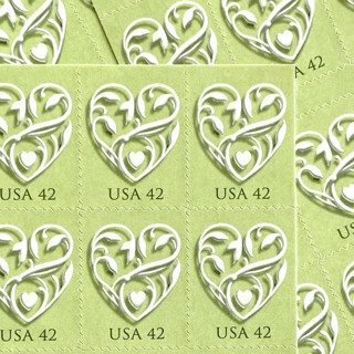 This is a green stamps by Heritage Post House called green wedding hearts postage stamps | wedding series | vintage unused usps postage 42c | pack of 10 in standard