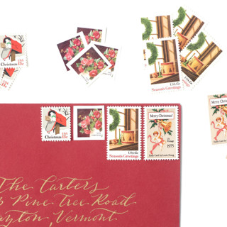 This is a red stamps by Flourish Fine Writing called red vintage holiday postage set -  2 ounce postage value per envelope, wreath and toys in standard
