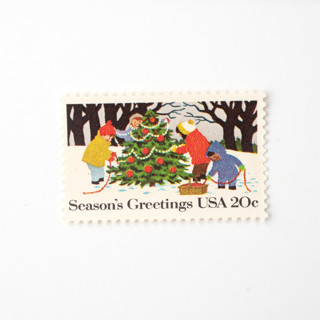 This is a green stamps by Flourish Fine Writing called 20 cent season's greetings children decorating a christmas tree // set of 10 // unused vintage stamps in standard