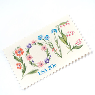 This is a pink stamps by Flourish Fine Writing called 20 cent floral love postage stamps // set of 10 // unused vintage stamps in standard