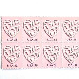 This is a pink stamps by Heritage Post House called pink wedding hearts postage stamps | wedding series | vintage unused usps postage 58c | pack of 10 in standard
