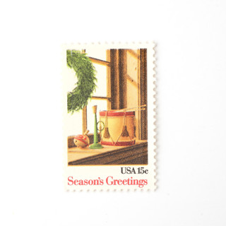This is a green stamps by Flourish Fine Writing called 15 cent christmas wreath & toys postage stamps // set of 10 // unused vintage stamps in standard
