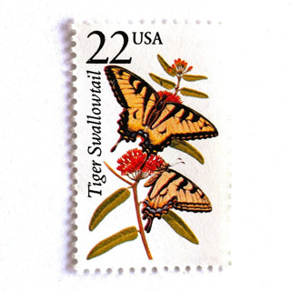 This is a yellow stamps by Heritage Post House called tiger swallowtail butterfly postage stamps | north american wildlife series | wedding stamps | vintage unused usps postage 22c | pack of 10 in standard