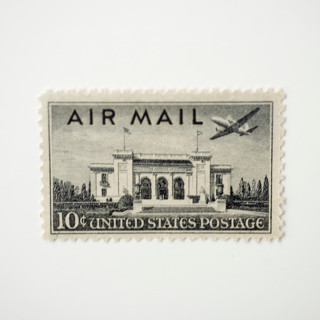 This is a black stamps by Flourish Fine Writing called 10 cent pan am building airmail postage stamps // set of 10 // unused postage stamps in standard