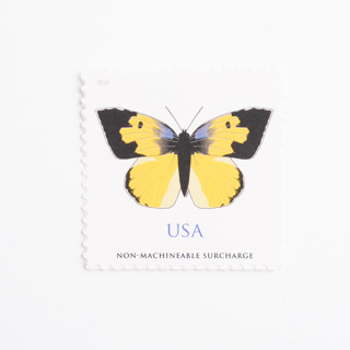 This is a yellow stamps by Flourish Fine Writing called forever dogface butterfly stamps // set of 10 //  1 ounce plus non-machinable // unused postage in standard