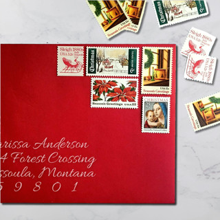 This is a red stamps by The Silver Stamps called holiday vintage postage set | christmas greetings | one ounce | set of 5 in standard