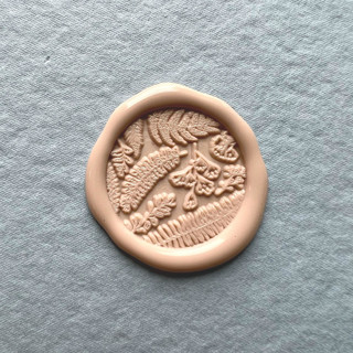 This is a natural wax seals by Eva Tadros called leafy garnish wax seal sticker _ nude_ pack of 10 in standard