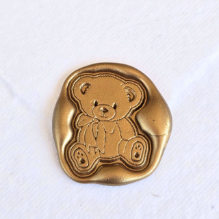 This is a multicolor wax seals by Inkspiringletters called teddy - customizable color- set of 25 hand-crafted wax seals in standard