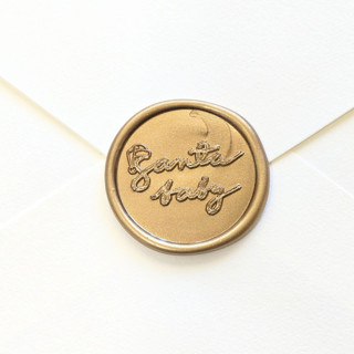 This is a multicolor wax seals by Inkspiringletters called santa baby - customizable color- set of 25 hand-crafted wax seals in standard