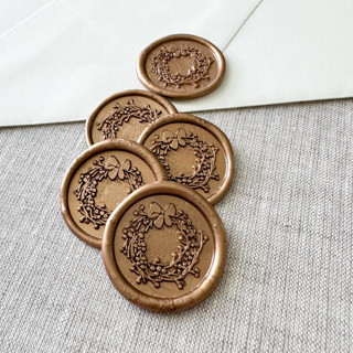 This is a gold wax seals by Maria Ferrer G. called antique gold christmas wreath wax seal sticker | set of 10 in standard