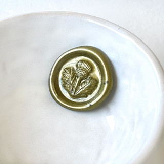This is a multicolorassorted-colors wax seals by Abby Choi called thistle wax seals pack of 10, customizable color in standard