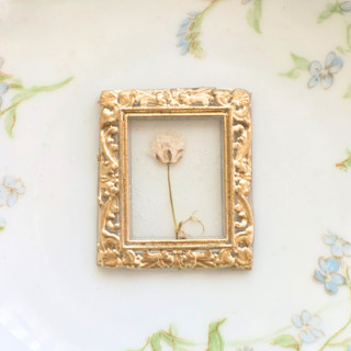 This is a clear wax seals by Inkspiringletters called framed flower- customizable fine art hand-crafted wax seals- set of 25 in standard