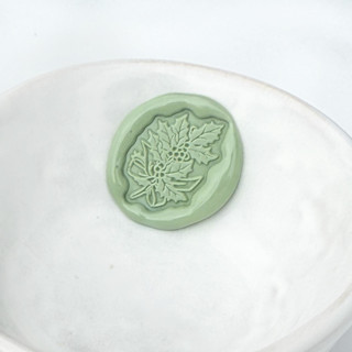 This is a multicolorassorted-colors wax seals by Abby Choi called holly berries wax seal, pack of 10, customizable color in standard