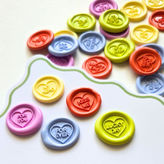This is a multicolorassorted-colors wax seals by Inkspiringletters called sweet hearts- assorted colors- set of 25 mini hand-crafted wax seals in standard