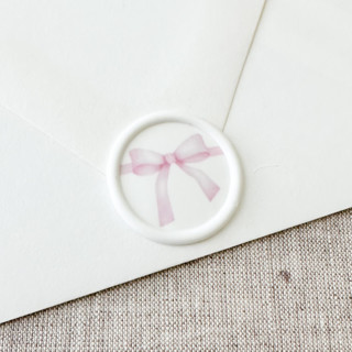This is a pink wax seals by Maria Ferrer G. called pink watercolor bow wax seal sticker | set of 10 in standard