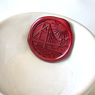 This is a multicolorassorted-colors wax seals by Abby Choi called golden gate bridge wax seal, pack of 10, customizable color in standard