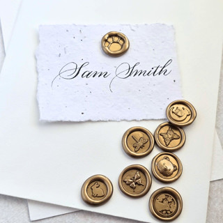 This is a multicolor wax seals by Inkspiringletters called mini animals- customizable color- set of 25 hand-crafted wax seals in standard