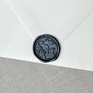 This is a black wax seals by Maria Ferrer G. called black graduation wax seal - graduation cap throw | set of 10 in standard