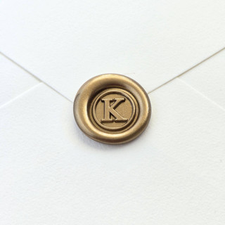 This is a multicolor wax seals by Inkspiringletters called mini monogram- customizable color- set of 25 hand-crafted wax seals in standard