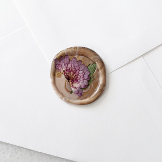 This is a purple wax seals by Caitlin Home called purple mums in blush gold marble wax seals | pack of 10 in standard