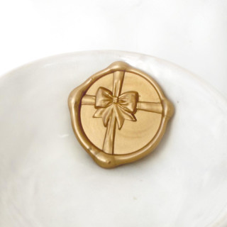 This is a multicolorassorted-colors wax seals by Abby Choi called gift bow wax seal, pack of 10, customizable color in standard