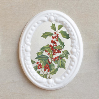 This is a white wax seals by Clover and Lamb called holiday wax seals // holly berry (set of 10) in standard