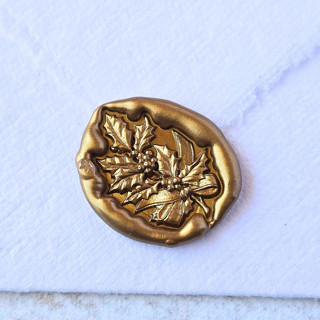 This is a multicolor wax seals by Inkspiringletters called holly branch- customizable color- set of 25  hand-crafted wax seals in standard