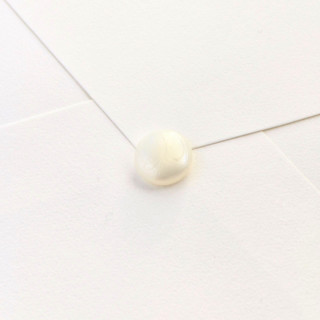 This is a multicolor wax seals by Inkspiringletters called mini natural hand-crafted wax seals - customizable color- set of 25 in standard