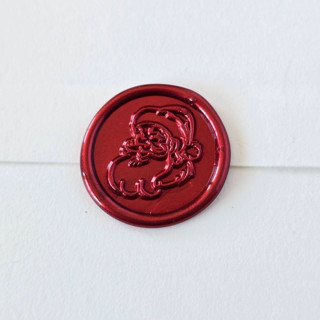 This is a multicolor wax seals by Inkspiringletters called st. nick - customizable color- set of 25 hand-crafted wax seals in standard