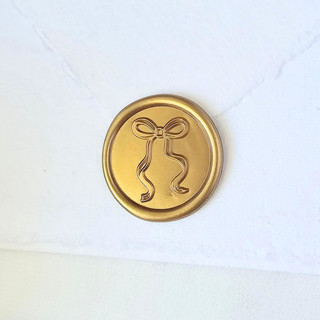 This is a multicolor wax seals by Inkspiringletters called long-tailed bow- customizable color- set of 25  hand-crafted wax seals in standard