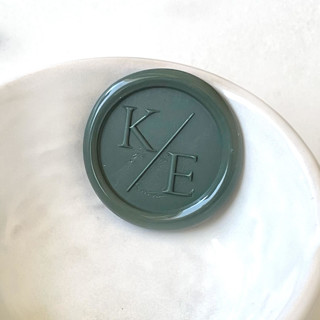 This is a multicolorassorted-colors wax seals by Abby Choi called serif initial wax seals, pack of 50, customizable in standard