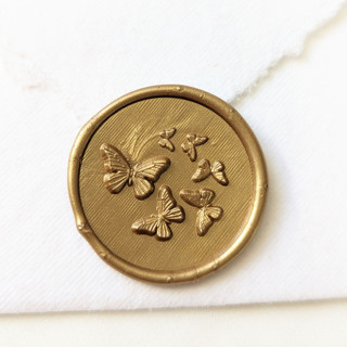 This is a multicolor wax seals by Inkspiringletters called butterfly garden- customizable color- set of 25 hand-crafted wax seals in standard