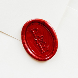 This is a red wax seals by Self Stationery called personalized oval wax seal stickers | custom two-letter monogram | set of 10 in standard