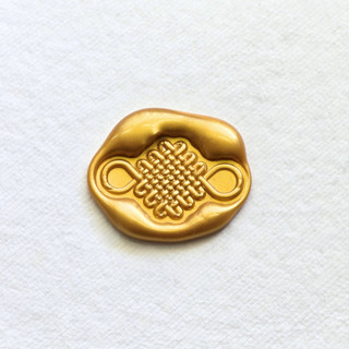 This is a multicolor wax seals by Inkspiringletters called lucky knot -hand-crafted wax seals - customizable color- set of 25 in standard